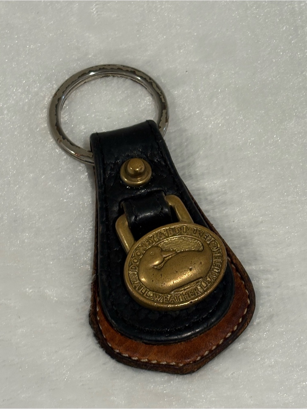 Dooney & Bourke Black and Brown Leather Key Fob with Brass Duck Medallion